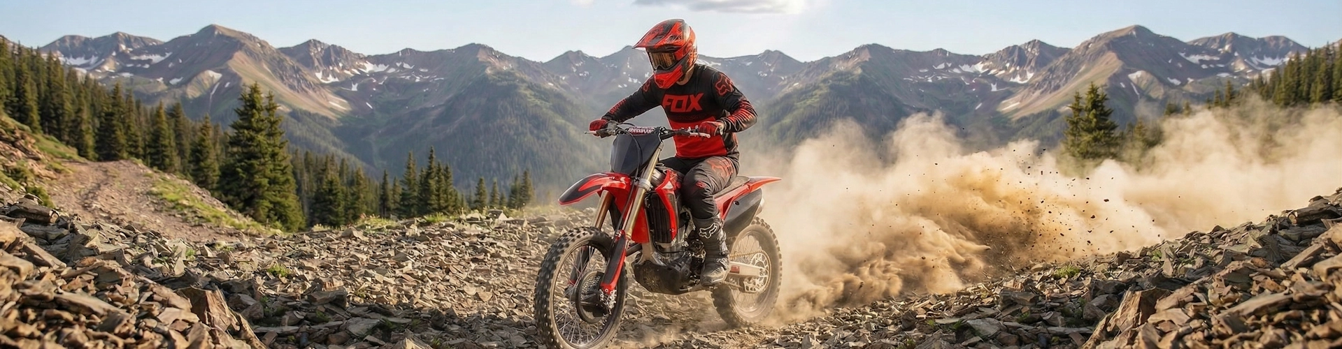 Hero banner showing person riding red dirt bike on rocky mountain trail